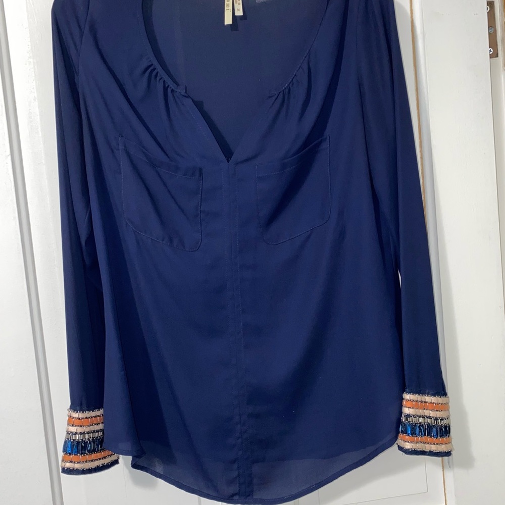 Blue blouse with hand beaded cuff on sleeves. From a vintage shop, worn once.